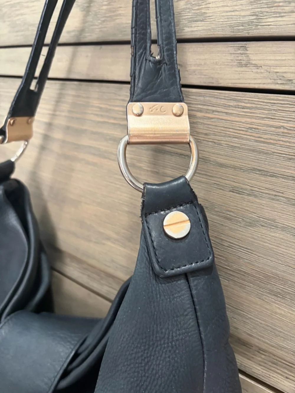 Foley & Corinna Black Leather Shoulder Bag with Modern Gold Accents